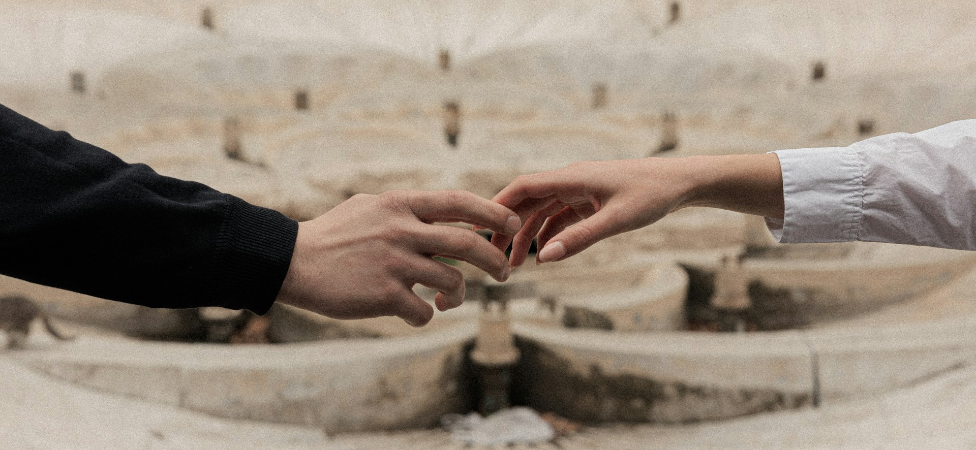 Two hands reaching out to each other